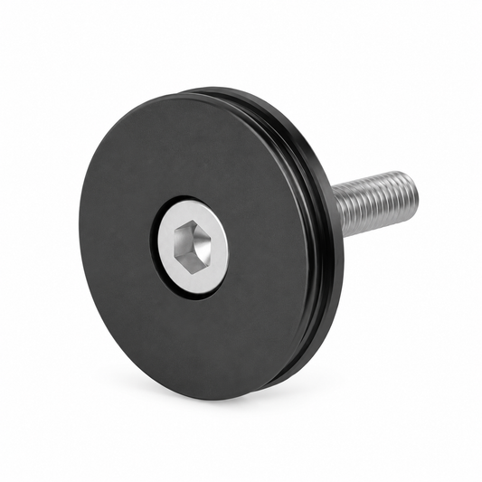 Black FIDLOCK VACUUM stem cap — product on a white background